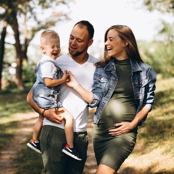 Husband with pregnant wife and their son